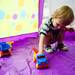 Ann Arbor resident Marco Angelucci-Ackerberg, 2, plays with toy trucks near the Ann Arbor District Library tent during the Taste of Ann Arbor on Sunday, June 2. Daniel Brenner I AnnArbor.com